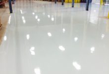 Thumbnail - warehouse floor epoxy coating - brown boxes in background
